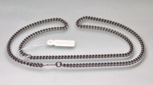 Detail view of a solid tantalum curb chain